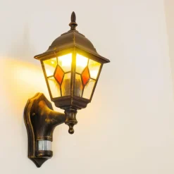 Luminaires Rustiques-hofstein Applique murale d'extérieur Antibes Brun doré, 1 lumière, Détecteur de mouvement