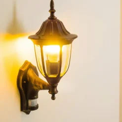 Luminaires Rustiques-hofstein Applique murale d'extérieur Ribadeo Noir doré, 1 lumière, Détecteur de mouvement